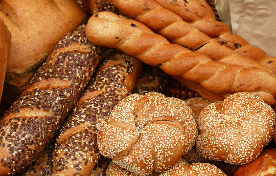 Fresh bread buns and loaves on retail display