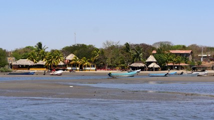 Fototapeta premium boats on the beach, Isla Juan Venado, Nicaragua