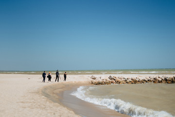 people film crew on the sea coast
