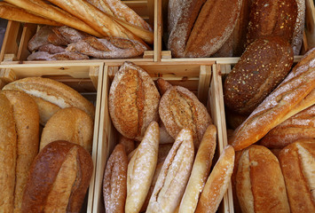 Fresh bread loaves and baguettes on retail display