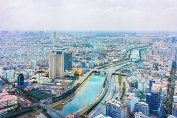 Fototapeta na wymiar Skyscrapers in Business District Ho Chi Minh and Saigon River