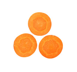 Close up three cut slices of carrot over white