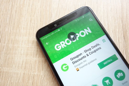 KONSKIE, POLAND - JUNE 17, 2018: Groupon - Shop Deals, Discounts and Coupons app on Google Play Store website displayed on Huawei Y6 2018 smartphone