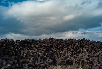 pile of peat bog cultivated for fuel drying in rural Ireland
