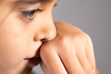 Extreme close up of child touch's her Nose - concept showing to prevent and Avoid touching your...