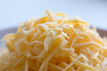 cooking tuna and spinach pie. raw tuna and spinach pie ingredients. Dough. grated cheese. Homemade tuna pie with cheese.