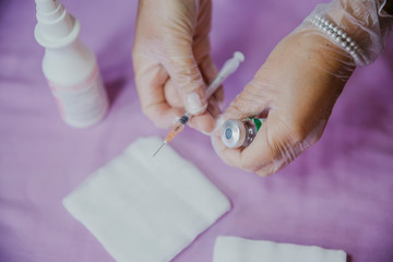 Syringe, medical injection in hand. Medicine vaccination equipment with needle. Nurse or doctor....