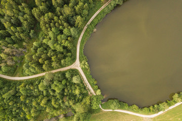 Top view of hiking path at lake shore in summer