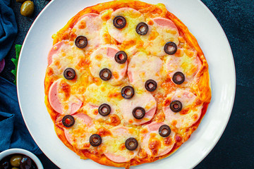 pizza sausage salami, olives and cheese. Menu concept food background. top view. copy space for text