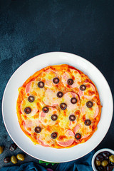pizza sausage salami, olives and cheese. Menu concept food background. top view. copy space for text