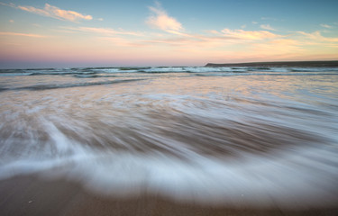 Close up Wide angle view of a wave washing up on the beach of Witsand in the Garden Route in the Western Cape of South Africa