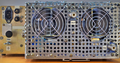 Rear panel of a high frequency power amplifier with vacuum tubes close up view