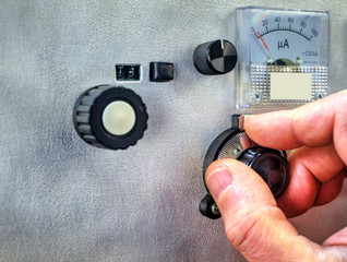 Radio amateur tuning the high frequency power amplifier close up view