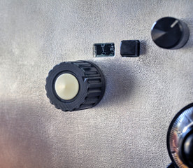 Front panel of a high frequency power amplifier with vacuum tubes close up view