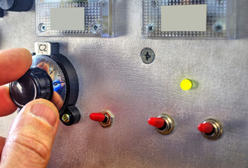 Radio amateur tuning the high frequency power amplifier close up view