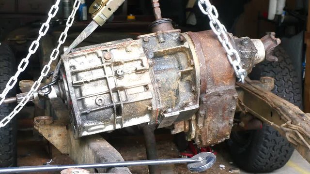 Manual Transmission and Transfer Case Suspended By Chain And Strap