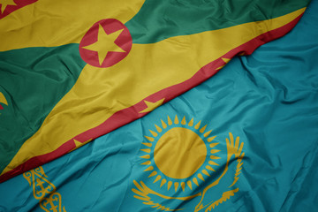 waving colorful flag of kazakhstan and national flag of grenada.
