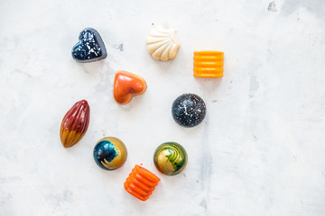 Designer sweets are made independently of Belgian chocolate. Top view copy space