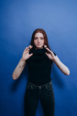 beautiful girl in an antiviral mask on a blue background