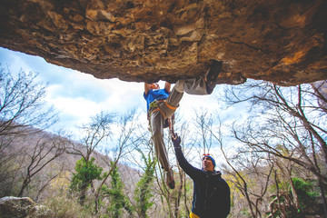 Man climbs a rock. 