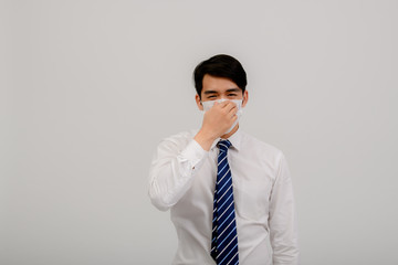 Asian male coughing, sneezing or having a runny nose and fever. Asian men exposed to coronavirus infection, coronavirus concept 2019