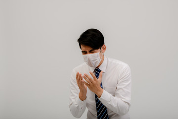 Asian male coughing, sneezing or having a runny nose and fever. Asian men exposed to coronavirus infection, coronavirus concept 2019