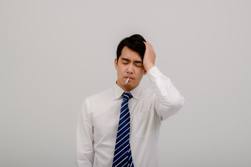 An Asian man, coughing, sneezing or having a runny nose and fever, has a Coronavirus reading his temperature on a thermometer. Isolated on white