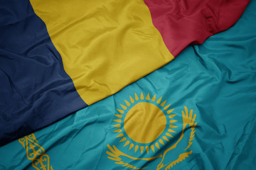 waving colorful flag of kazakhstan and national flag of chad.