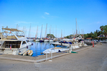 Fototapeta na wymiar Yachts at the pier in summer at the port
