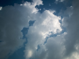 The sky is blue, the clouds are white.