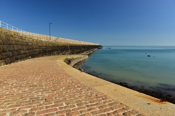 Obraz premium St Catherines breakwater, Jersey, U.K. Coastal structure jutting out to the sea built 1850.