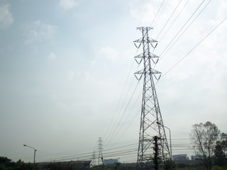High-voltage pylons on a blue sky background.