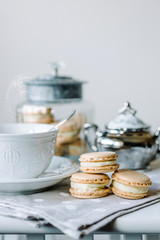 Homemade macarons pastries with custard on the table
