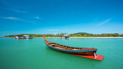 Naklejka na ściany i meble Tropical Sea With Wooden Boat 