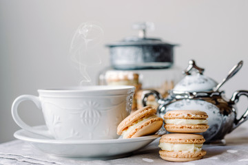 Homemade macarons pastries with custard on the table