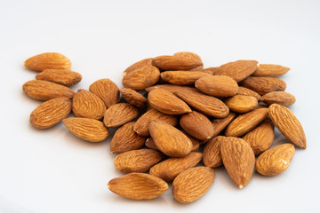 almond, almonds, background, brown, brown almond, care, close-up, closeup, cure, diet, drupe, drupes, food, good, good fat, health, healthy, healthy food, heap, ingredient, iran, isolated, macro, natu