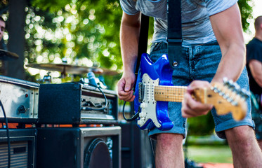 Musician play guitar on the stage in a live performance