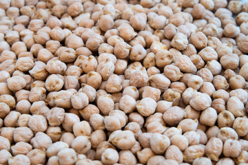 Closeup of stacked chickpeas on display with focus in the middle