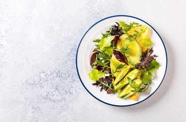 Breakfast green omelet, salad mix and avocado. Concept Healthy food in the morning.