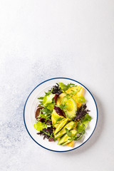 Breakfast green omelet, salad mix and avocado. Concept Healthy food in the morning.