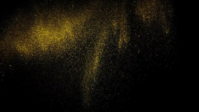 Golden glitter sand or dust creating abstract cloud formations metamorphosis. Art backgrounds. Super Slow Motion at 1000fps.
