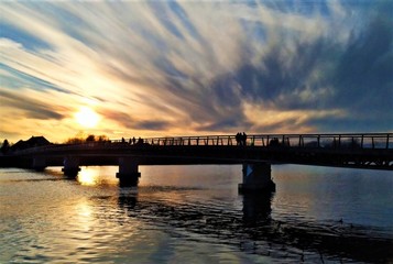 Fototapeta na wymiar Sunset at the end of the bridge