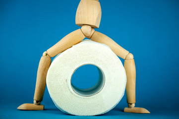 wooden mannequin on toilet paper, hype on toilet paper