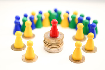 Successful Financial Winner. Leader Figure standing on stack of coins