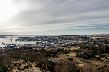 Fototapeta na wymiar A view of Tananger suburb and industrial area with Risavika port facilities, Sola commune, Norway, March 2018