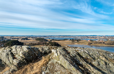 Fototapeta na wymiar Spring landscape view of Hafrsfjord fjord and its coastline from Tananger suburb, Stavanger, Norway, March 2018