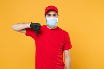 Fototapeta na wymiar Delivery man in red cap blank t-shirt uniform sterile face mask gloves isolated on yellow background studio Guy employee working courier Service quarantine pandemic coronavirus virus 2019-ncov concept