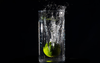 Throwing the lemon into a jar of water