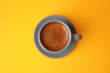 top view of turkish coffee placed on yellow background