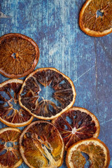 Fototapeta na wymiar Dry blood orange slices on blue background